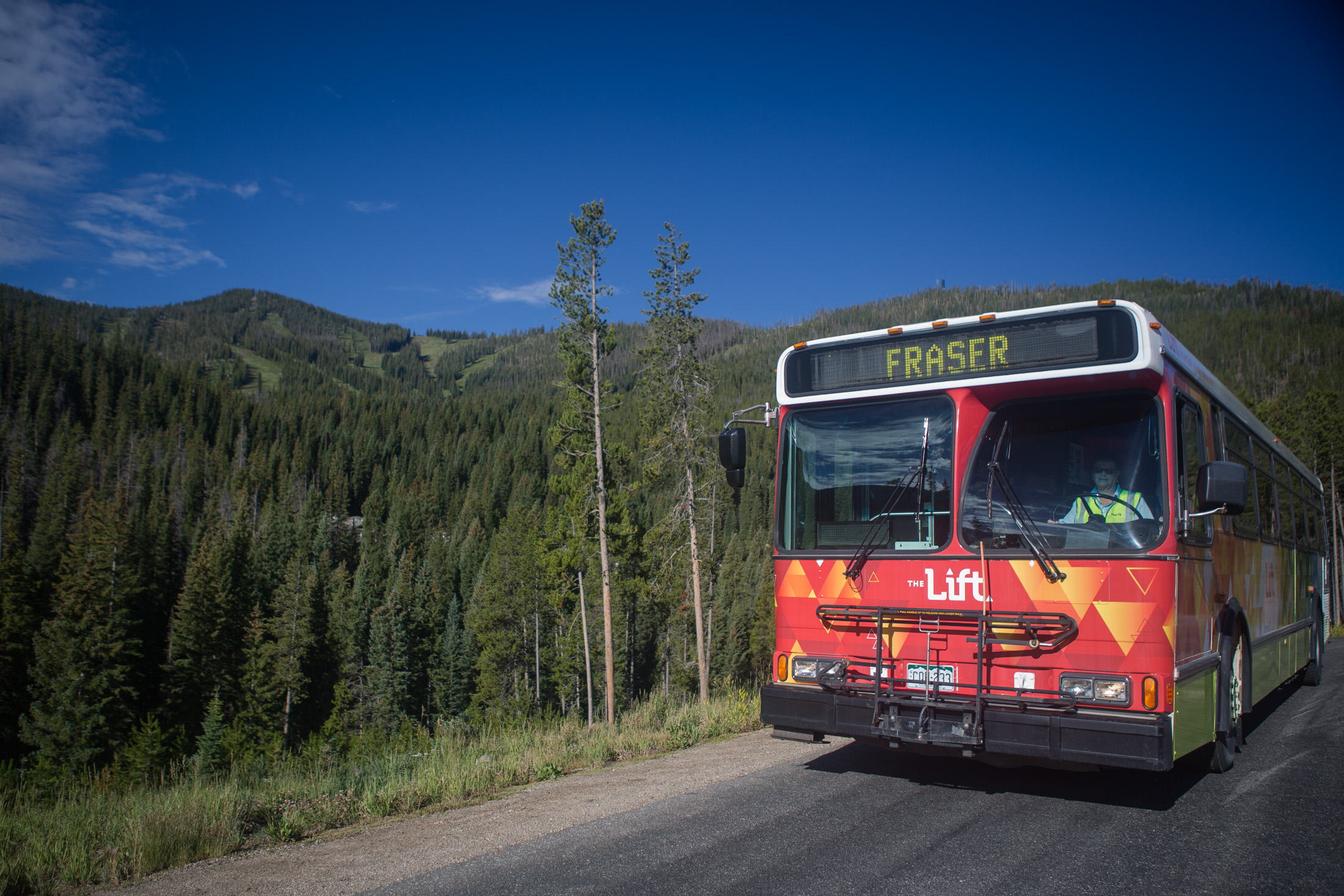 Lift bus in summer with mountain in the background