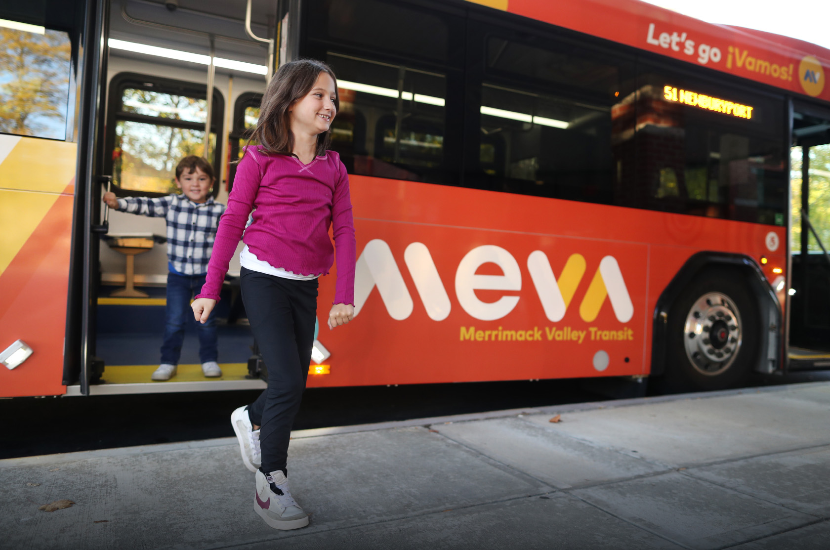 Kids stepping off the meva bus
